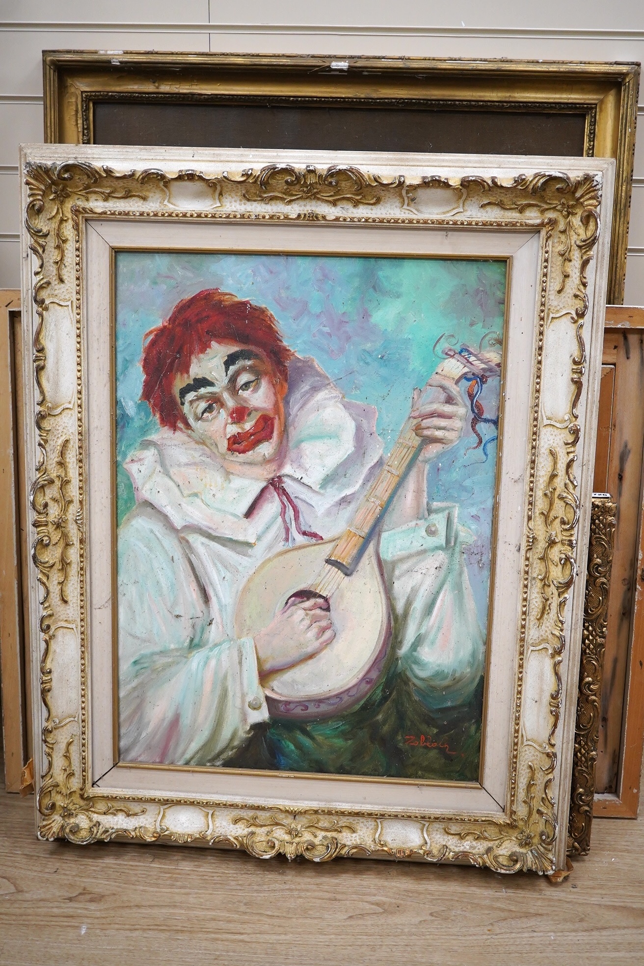 Zolback ?, Continental School, oil on canvas, Portrait of a clown playing an instrument, indistinctly signed, 69 x 49cm, ornately framed. Condition - fair to good, would benefit from a clean